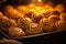 a pan full of cinnamon buns with a flame in the background