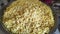 A pan full of fried puffed rice grains