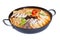 Pan of korean soup with kimchi, dumplings, beef and vegetables isolated