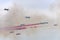 PAN military team trough their colored smoke in flight at airshow, Linate, Italy