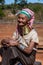 Pan Pet, Kayah State, Myanmar - February 2020: Portrait of an elderly Kayan longneck woman or Paduang wearing pink headdress
