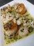 Pan seared scallops with baby shrimp with lemon garlic tarragon butter