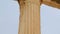 Pan shot of tall marble column with sophisticated capital, Ionic architecture