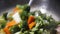 Pan shot of woman cooking vegetable in a pan