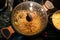 Pan on the stove with condensation on the glass lid, close-up