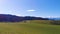 Pan of Swiss mountains in Bern with green grass and mountains