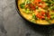 Pan with tasty omelet on grey table, closeup