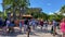 A pan view of Jungle Cruise with people walking wearing face masks and social distancing in Disney World