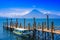 Panajachel, Guatemala -April, 25, 2018: The docks in Panajachel with San Pedro volcano in the background. A few small