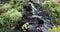 Panama Boquete waterfall on the rocks at the flower fair