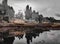 Panaromic shot of a forest harbour reflecting in water in winter