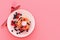 Pancake with blueberry and strawberry in the plate on pink pastel