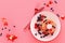 Pancake with blueberry and strawberry in the plate on pink pastel background.