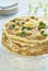 Pancake cake with liver, sour cream and parsley