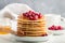 Pancake with honey and fresh berries. Cranberry, cowberry