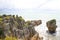 The Pancake Rocks are a heavily eroded limestone area where the sea bursts through several vertical blowholes during high tides. L