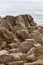 Pancake Rocks. Piles of stone pancakes on the shore. South Island, New Zealand