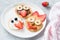 Pancakes art for kids on white plate. Colorful kids meal