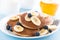 Pancakes with banana and blueberries on a plate