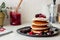 Pancakes with blackberries, raspberries and red currants. American cuisine