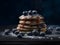 Pancakes with blueberries and maple syrup on a dark background