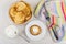 Pancakes in bowl, soft cottage cheese, spoon, napkin and fork