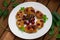 Pancakes with cherries. Wooden background. Close-up. Top view