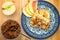 Pancakes with cottage cheese and jam from apple and peach. Wooden background. Close-up. Top view