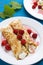 Pancakes with cream and raspberries