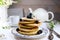Pancakes with fresh blueberries and flowers