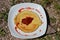 Pancakes with fresh strawberries on white plate