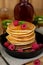 Pancakes hotcakes with berries and fruit served with maple syrup