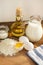 Pancakes ingredients. Milk egg flour oil sugar. Wooden background