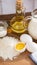 Pancakes ingredients. Milk egg flour oil sugar. Wooden background