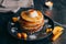 Pancakes with peaches, cream and honey
