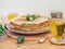 pancakes on a plate decorated with feijoa, acacia honey in a crystal vase, green tea with a slice of lemon in a transparent