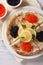 Pancakes with red and black caviar closeup, vertical top view