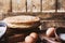 Pancakes on rustic table, ingredients, making blini crepes