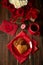 Pancakes with tea cup, gift boxes, hearts and roses on wooden background. Valentines, mothers day and birthday celebration concept