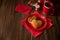 Pancakes with tea cup, gift boxes, hearts and roses on wooden background. Valentines, mothers day and birthday celebration concept