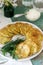 Pancakes with zucchini and sweet corn, served with sour cream, parsley and dill. Vegetarian food.