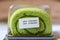Pandan flavor roll cake in package with expiry date tag