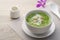 Pandan flavoured Tapioca pearl pudding with a dash of coconut milk,popular South-East Asian dessert in white bowl