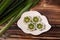 Pandan jelly in a white plate on a wooden background