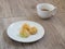 Pandanus leaf cream Eclairs on white plate and white cup of coffee