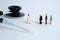 Pandemic coronavirus conceptual miniature people photography â€“ a group of people line up in line for a health check