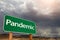 Pandemic Green Road Sign Against Ominous Stormy Cloudy Sky