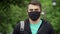 Pandemic, portrait of young tourist man wearing protective mask on street. N1H1 coronavirus quarantine, virus protection