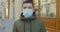 Pandemic protection of the Covid-19 coronavirus. Portrait of a caucasian man in a medical face mask. Virus protection.