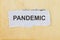 Pandemic word written on a vintage brown paper